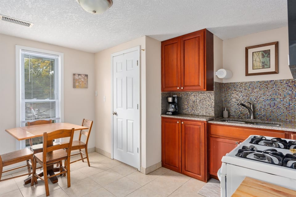 The upstairs kitchen overlooks the quiet Corcoran neighborhood. 