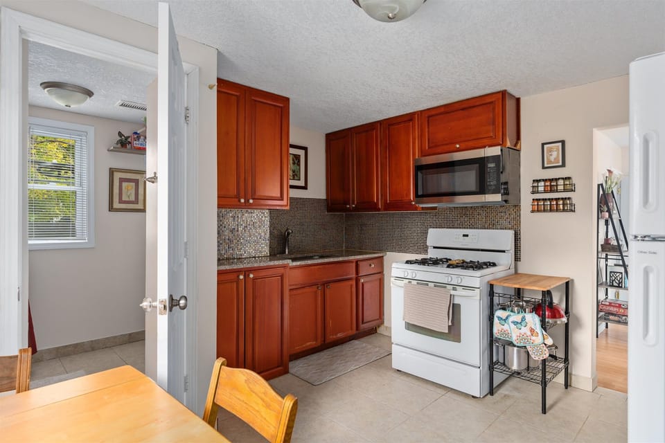 The upper kitchen has the same amenities and together, the house can seat 8 (plus bonus folding chairs). 