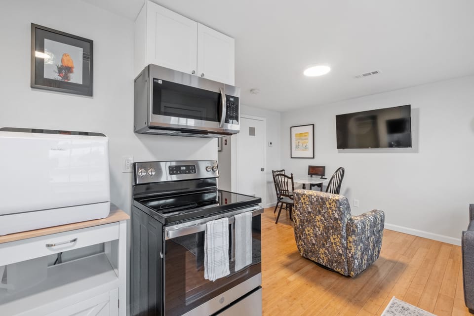 Kitchen is stocked with utensils and cookware to prepare meals.