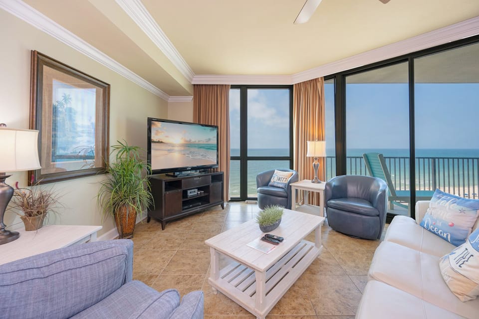Relax in the inviting living area with a plush sofa with queen sleeper, a cozy chair, and stunning views