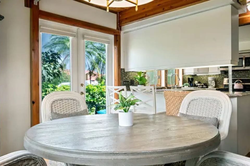 Inviting dining area with direct access to the pool and grill