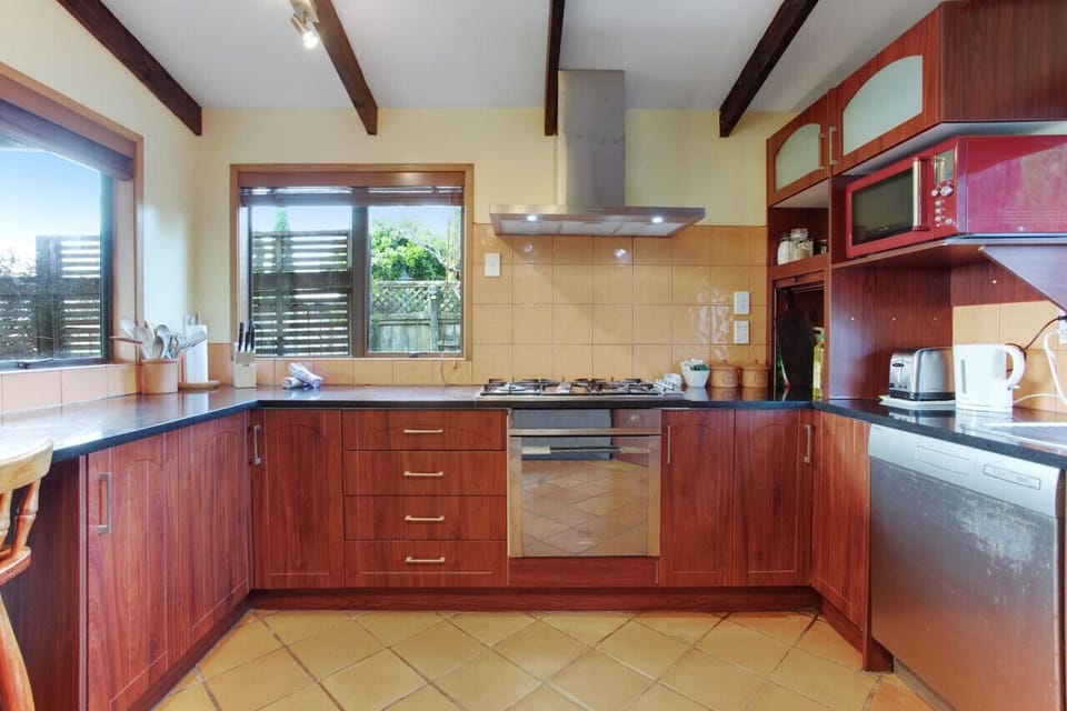 The kitchen has a oven, gas cook top, dishwasher, microwave and fridge/freezer.