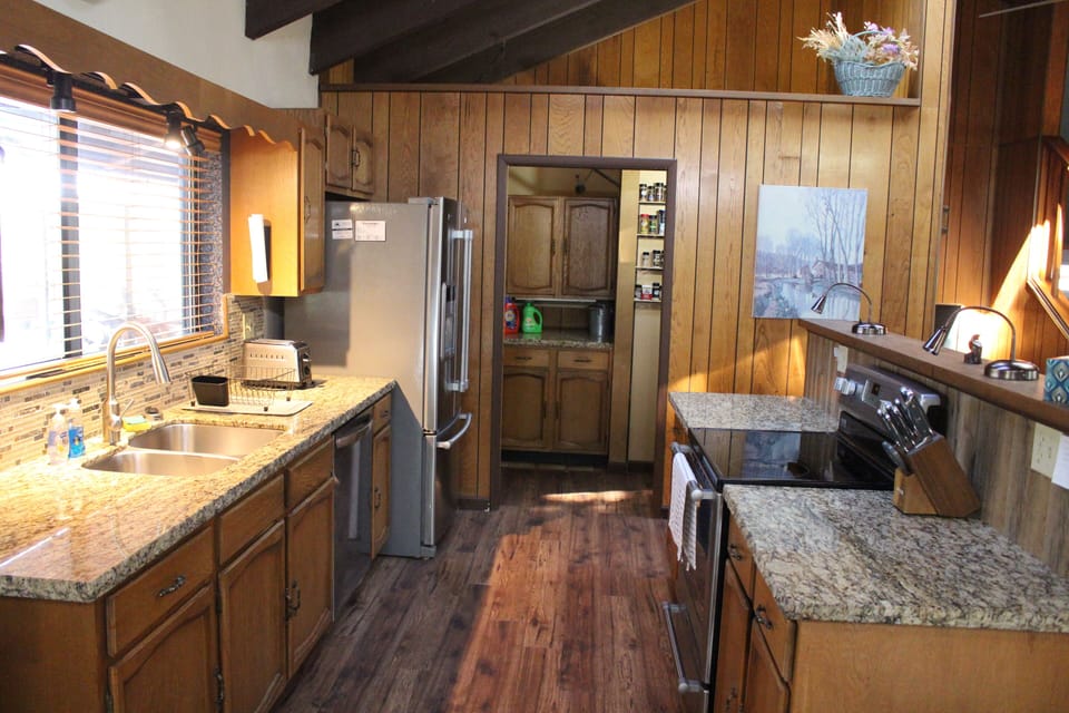 Kitchen with laundry room/pantry in background