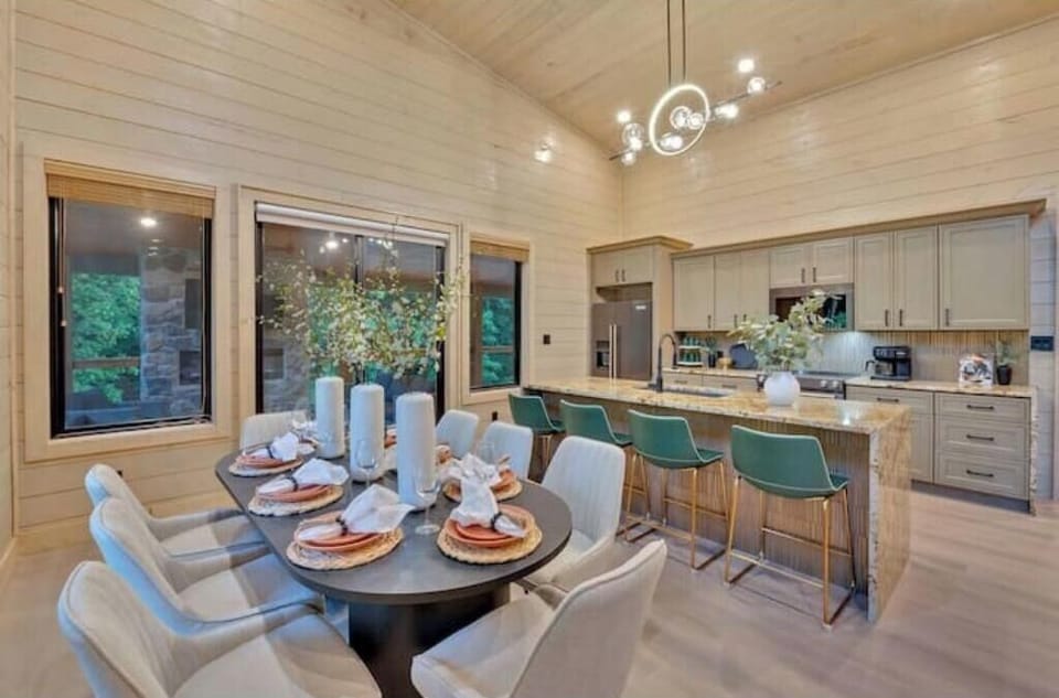 Dining table with seating for 8, and kitchen island with seating for 4.