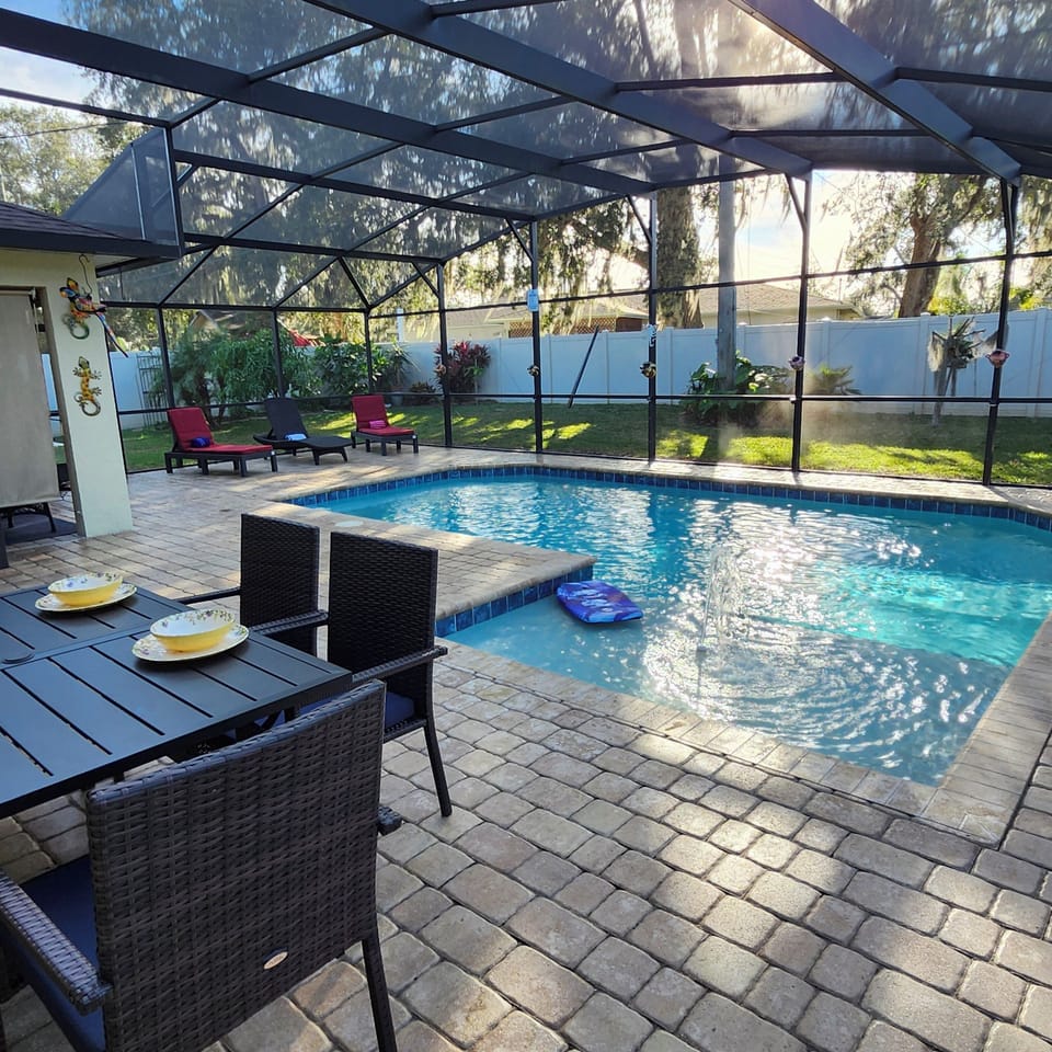 Salt Water Pool with outdoor seating and private fenced in backyard 