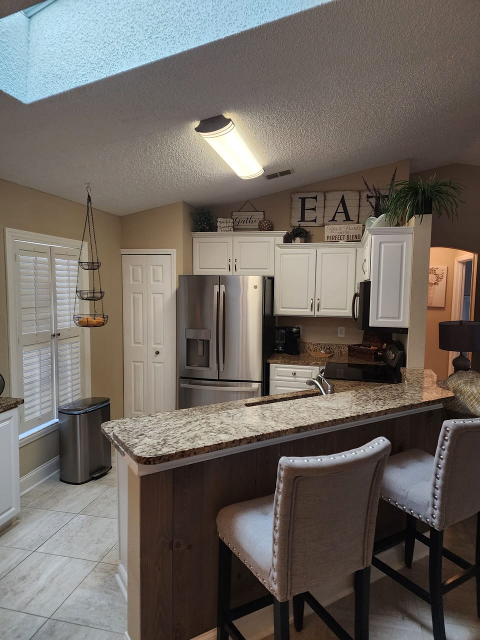 Open concept kitchen overlooking the salt water pool 