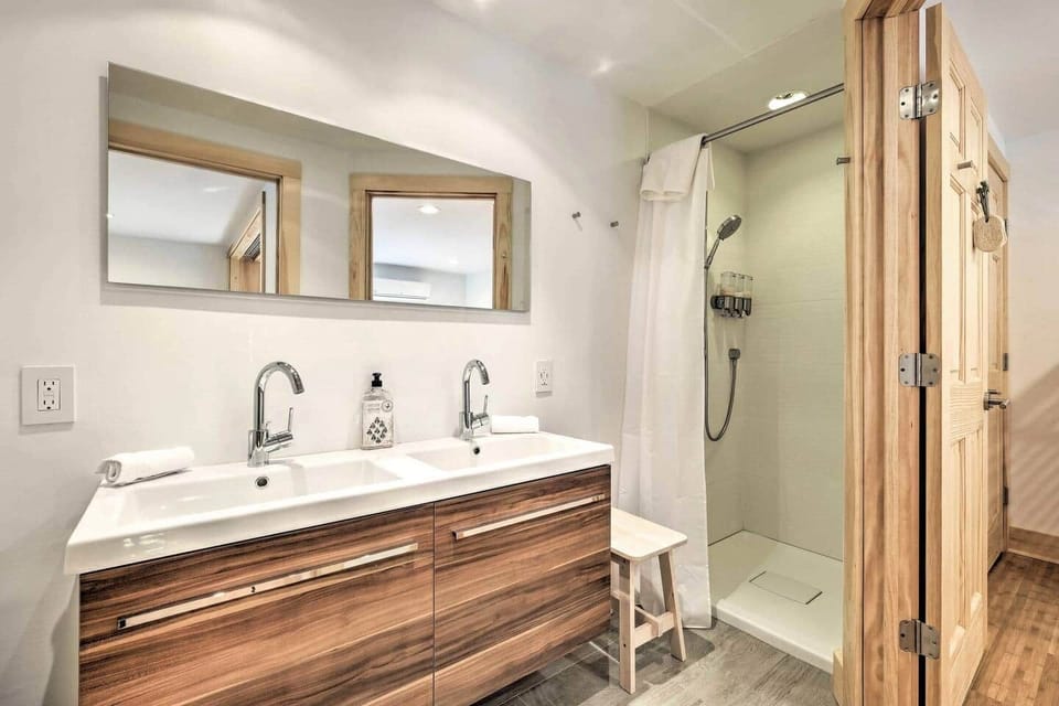 Double sink, shower stall, and toilet closet for bedroom 4.