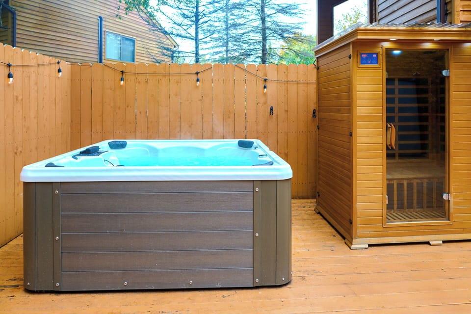 Sauna and hot tub in back patio area. 
