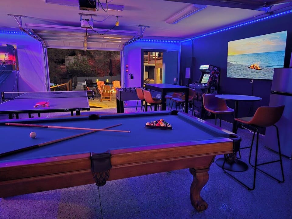 Awesome gameroom with pool table, foosball, ping pong and arcades