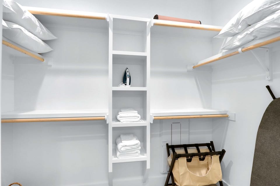 Keep clothes & bags tucked away in the master walk-in closet