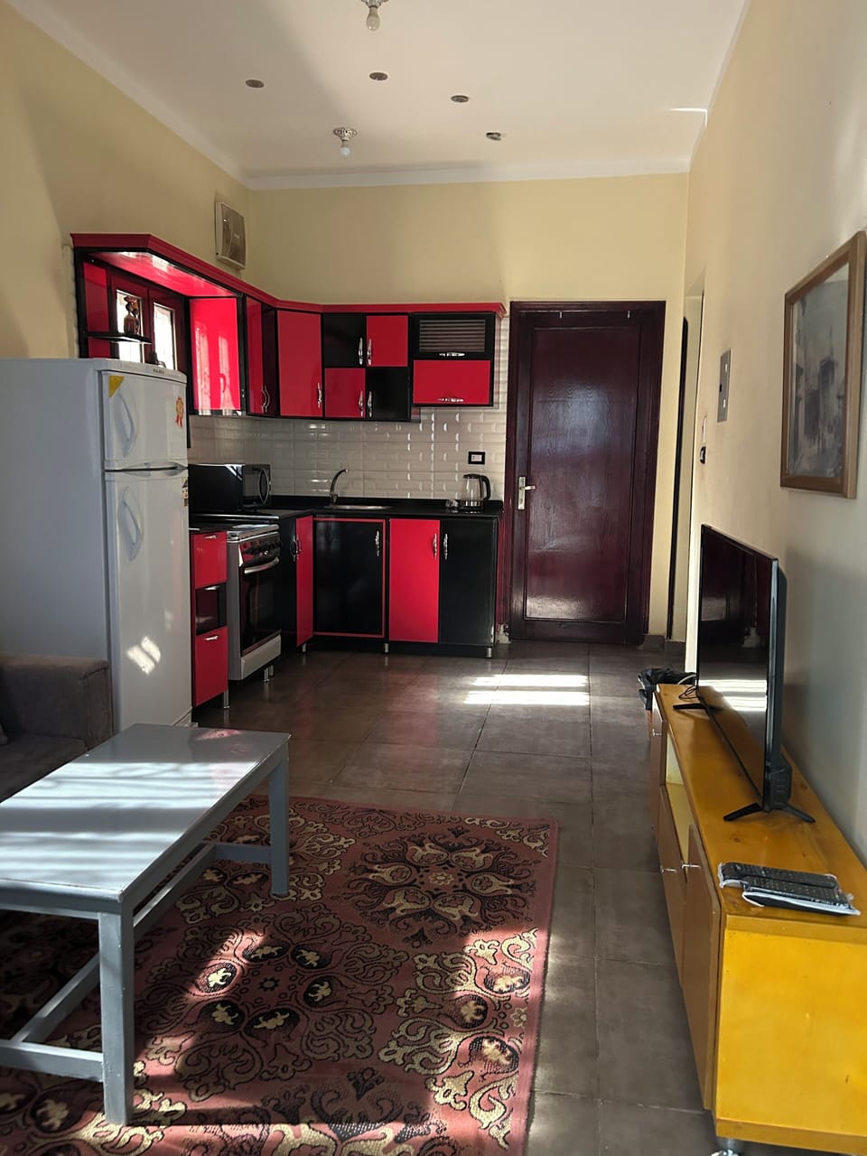 Two Bedroom Apartment | Living area | 32-inch Smart TV with satellite channels, fireplace