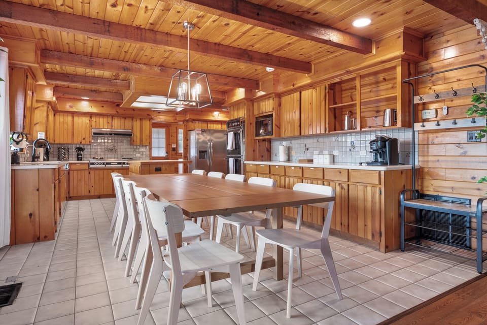 Dining room with seating 10, perfect for vibing for those working in the kitchen or those hanging out in the living room. Coffee bar supports both K-cups and drip coffee, sure to please even the pickiest of coffee enthusiasts