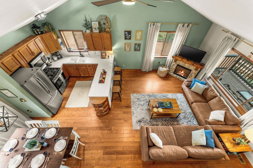 Warm, open layout—kitchen, dining, and living spaces all within easy reach. 