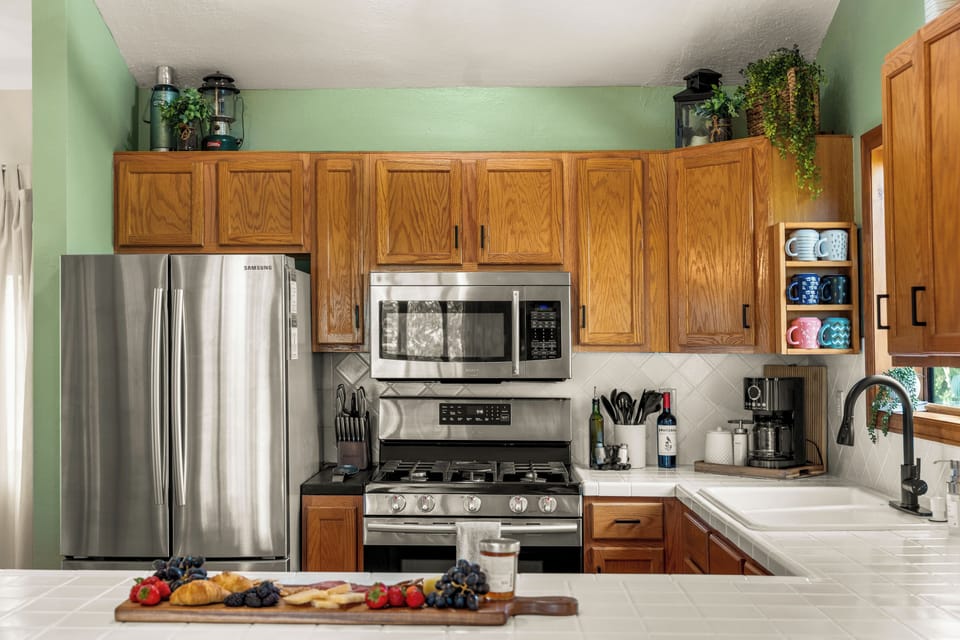 Fully equipped kitchen with spices, appliances, and room for sous chefs!