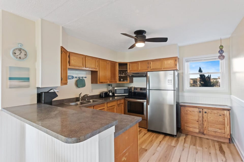 The well-equipped Kitchen and Dining Area with seating for 6 makes meal prep and dinner time a breeze.