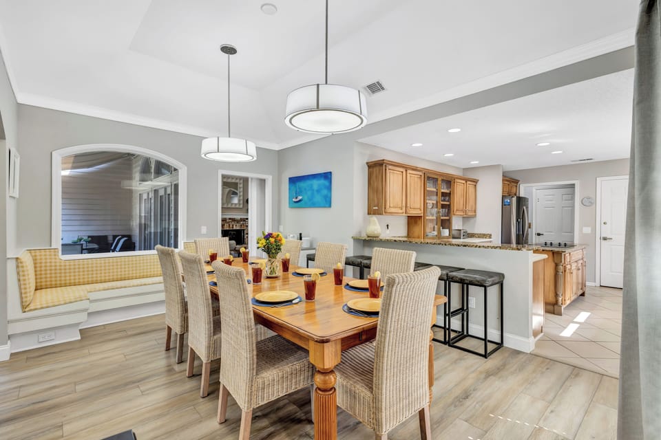 Adjacent to this, a fully-equipped kitchen is ready to handle casual meals and holiday feasts alike.