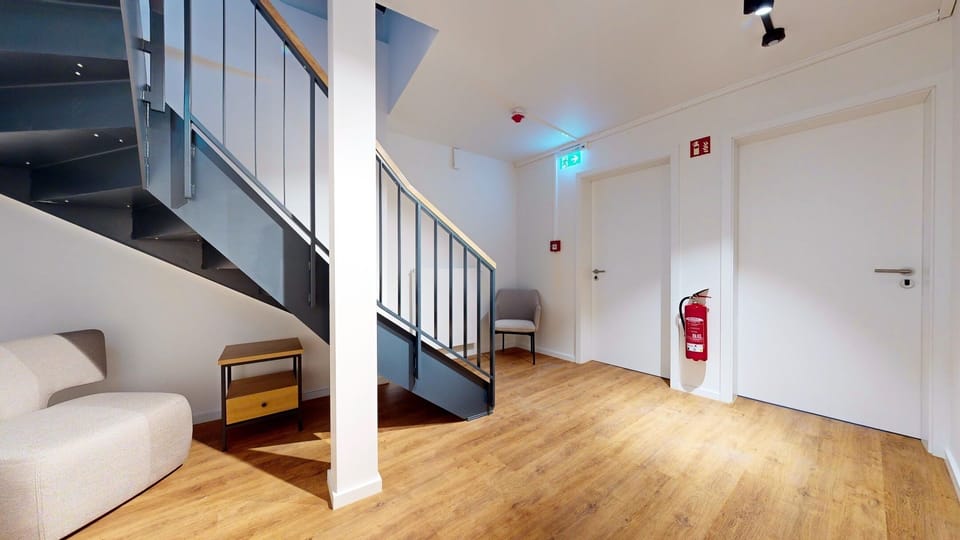 Stylishly designed hallway in the N°8A Boardinghouse -here the entrance doors to apartments 9 and 10
