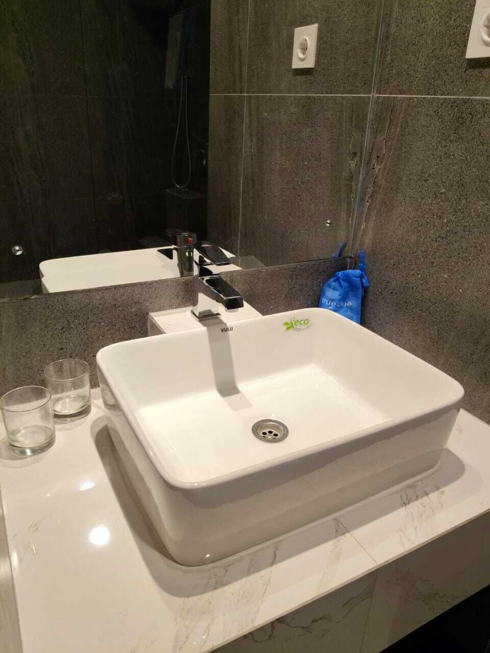 Shower, rainfall showerhead, slippers, towels