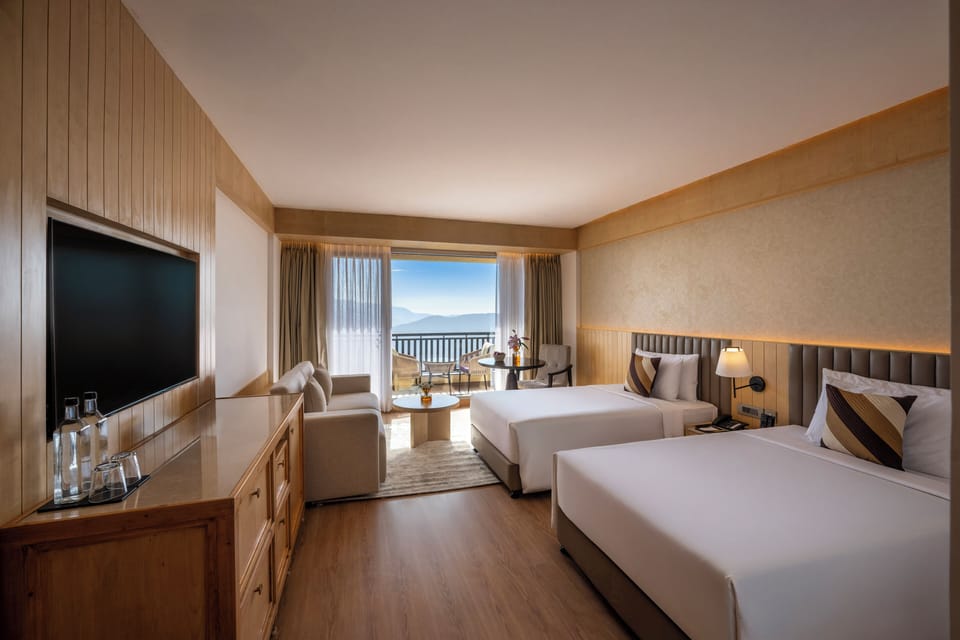 Superior Twin Room, Balcony, Mountain View | Minibar, in-room safe, iron/ironing board, free cribs/infant beds
