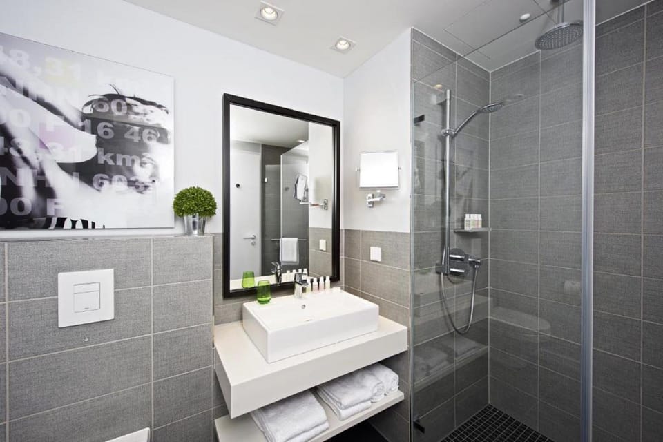 Shower, eco-friendly toiletries, hair dryer, bathrobes