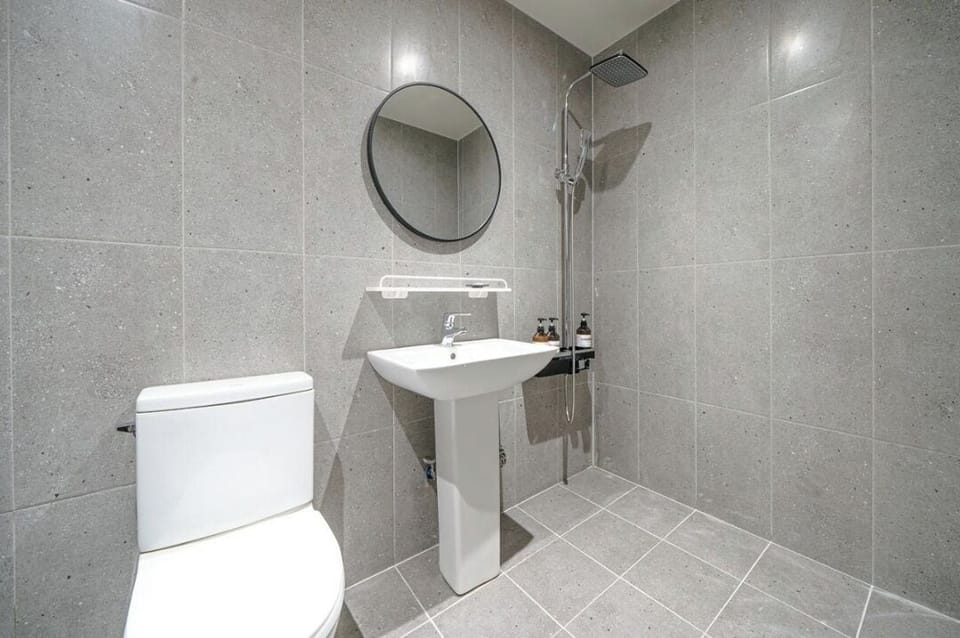 Business | Bathroom | Hair dryer, towels, soap, shampoo