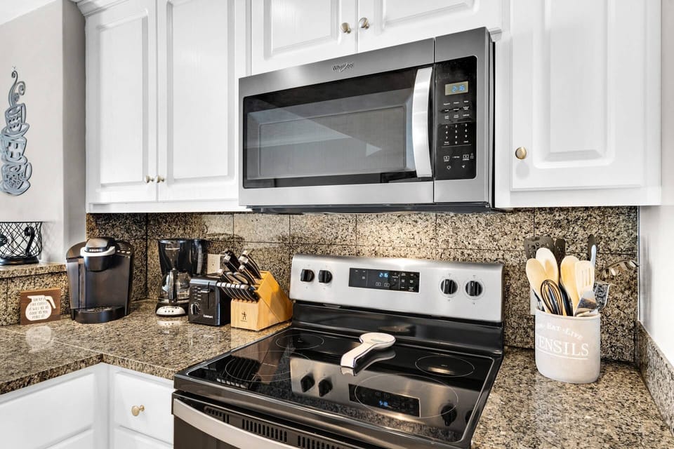 The nicely appointed kitchen features both keurig and drip coffee makers