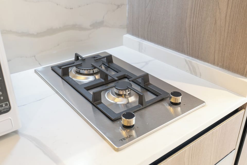 Deluxe Studio, Balcony, City View | Private kitchen | Fridge, microwave, oven, stovetop