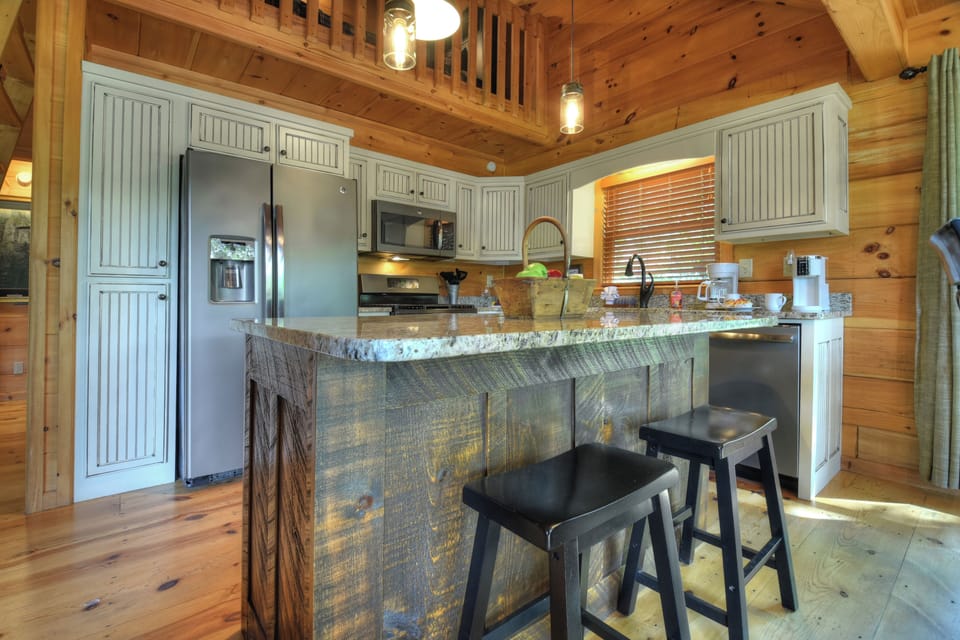 Fully stocked kitchen with an island for extra seating
