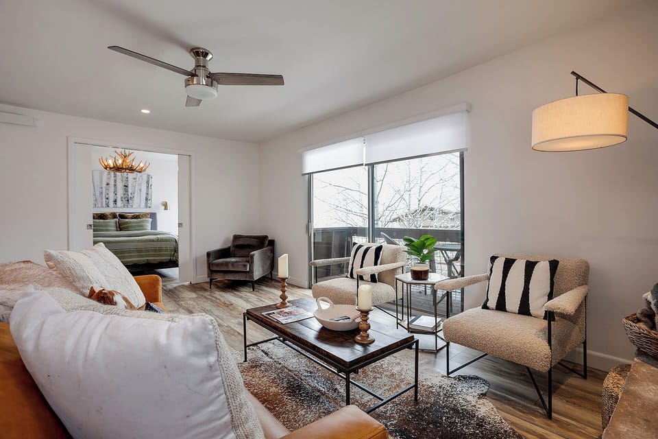 Unwind in your stylish living room, where modern comfort meets thoughtful design with plush seating and natural light.
