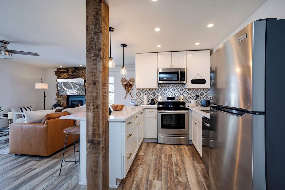 Your fully equipped kitchen features stainless steel appliances and stylish backsplash, perfect for preparing memorable meals during your stay.