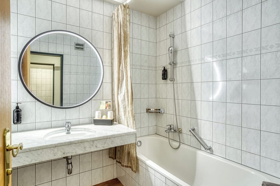 Signature Double Room | Bathroom | Hair dryer, bathrobes, towels, soap