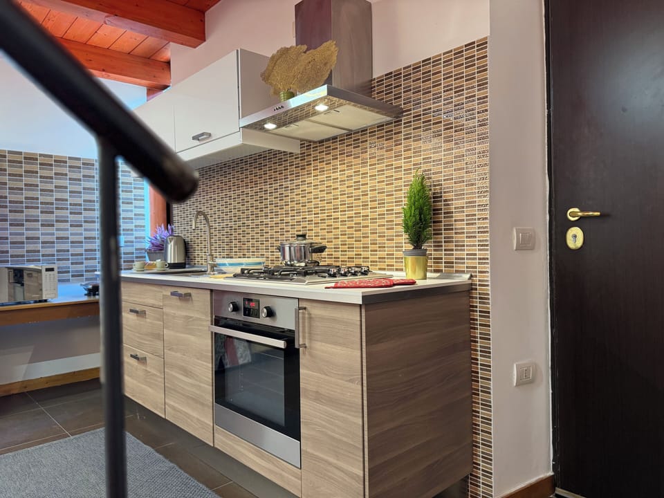 Deluxe Condo, Balcony, City View | Private kitchen | Full-size fridge, microwave, oven, stovetop