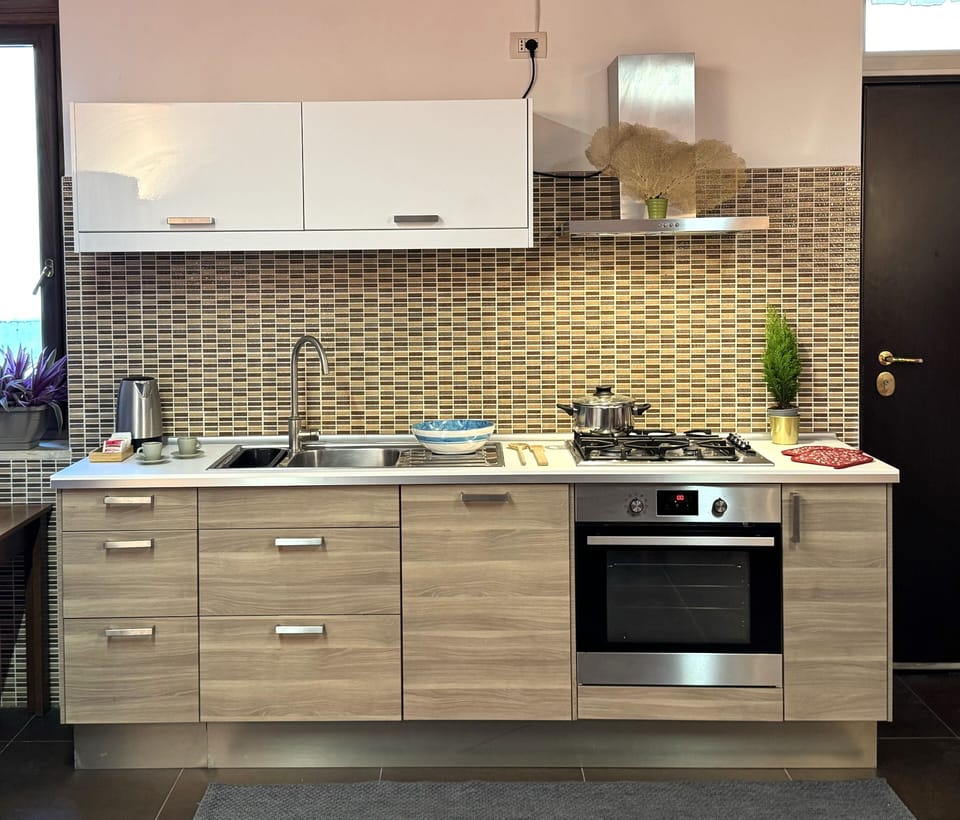 Deluxe Condo, Balcony, City View | Private kitchen | Full-size fridge, microwave, oven, stovetop
