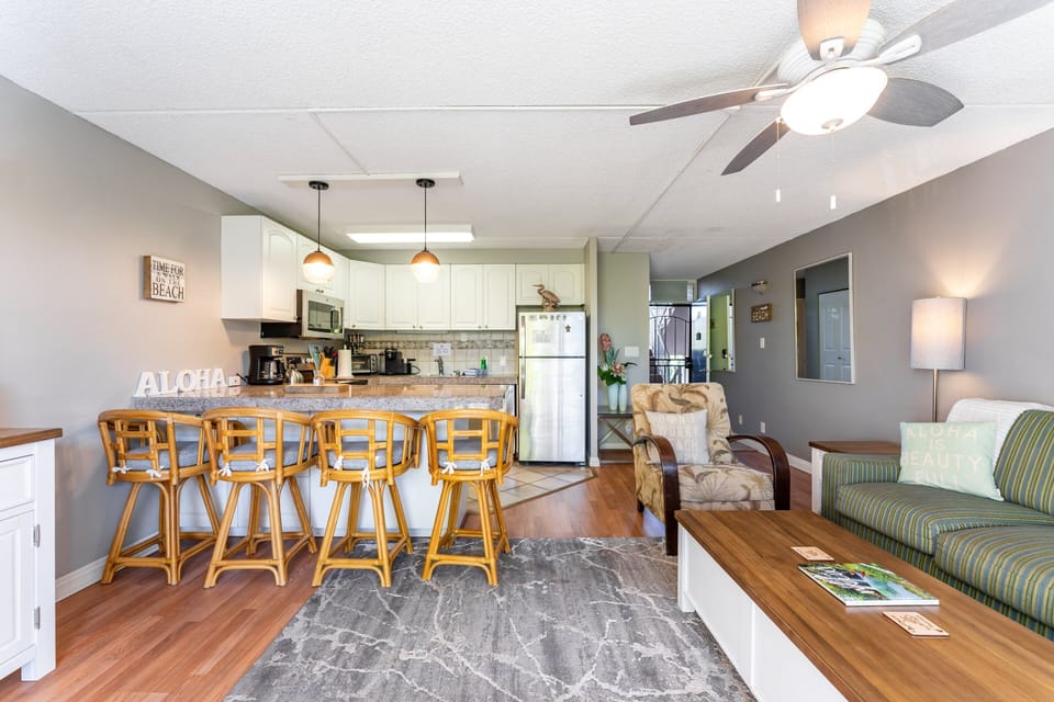 Great Room with window AC, queen sleeper sofa, cable and smart TV, free Wifi, spacious kitchen with dining area and lanai  with small seating area