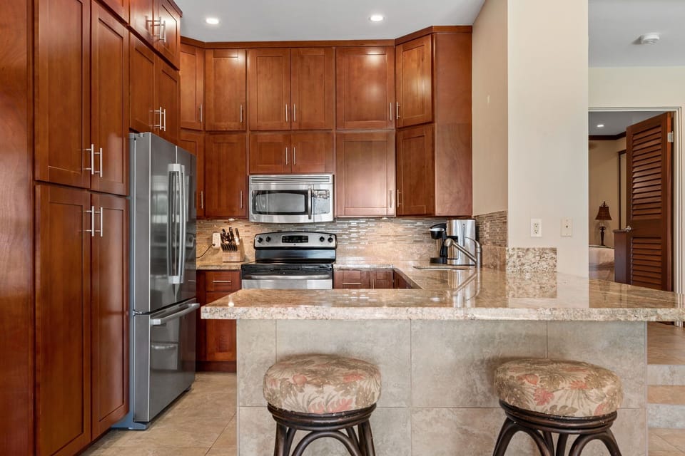 Beautiful renovated kitchen with fridge, stove, oven, dishwasher, microwave, coffee maker, toaster and many more