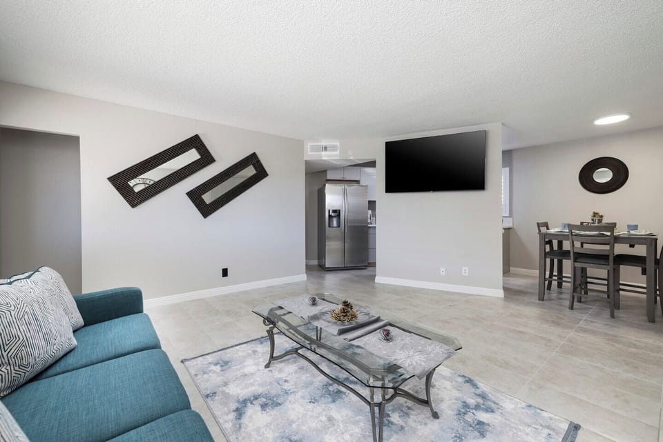 Oversized family room with a wall mounted flat screen TV.  
