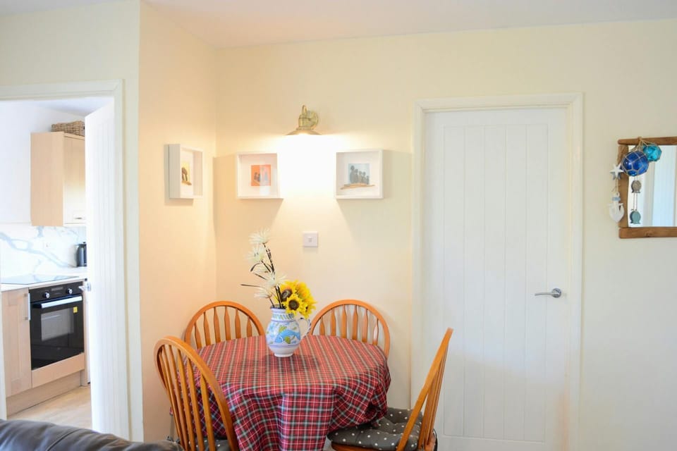 Circular dining table with four chairs