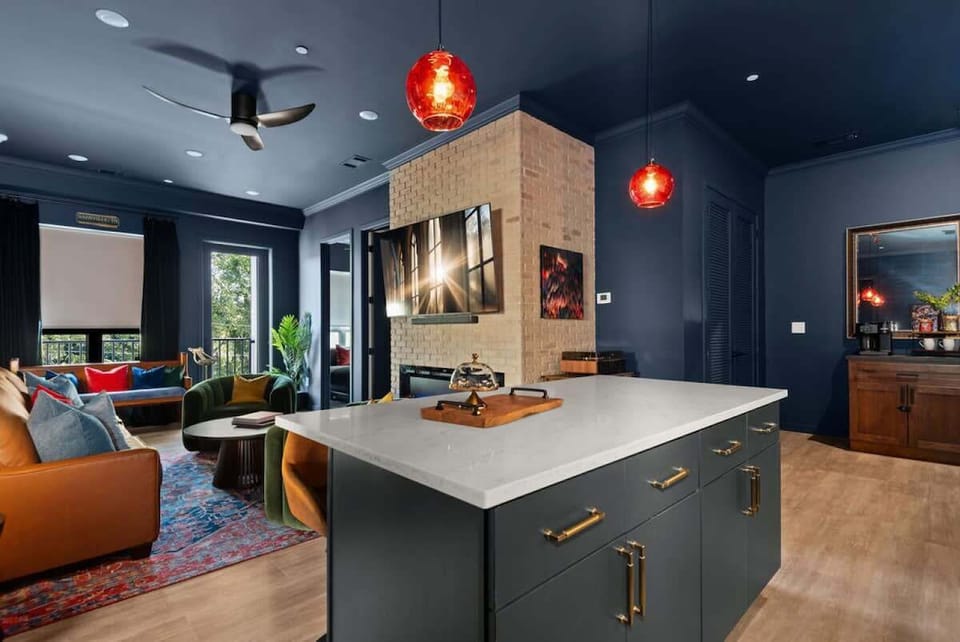 A beautifully designed kitchen with an open view of the living room, creating a seamless flow for cooking and entertaining.