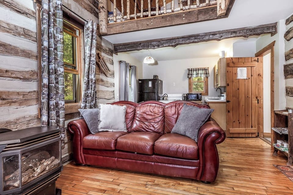  Cozy Living & Dining Areas: Lounge by the fireplace, enjoy TV, or stream via Wi-Fi