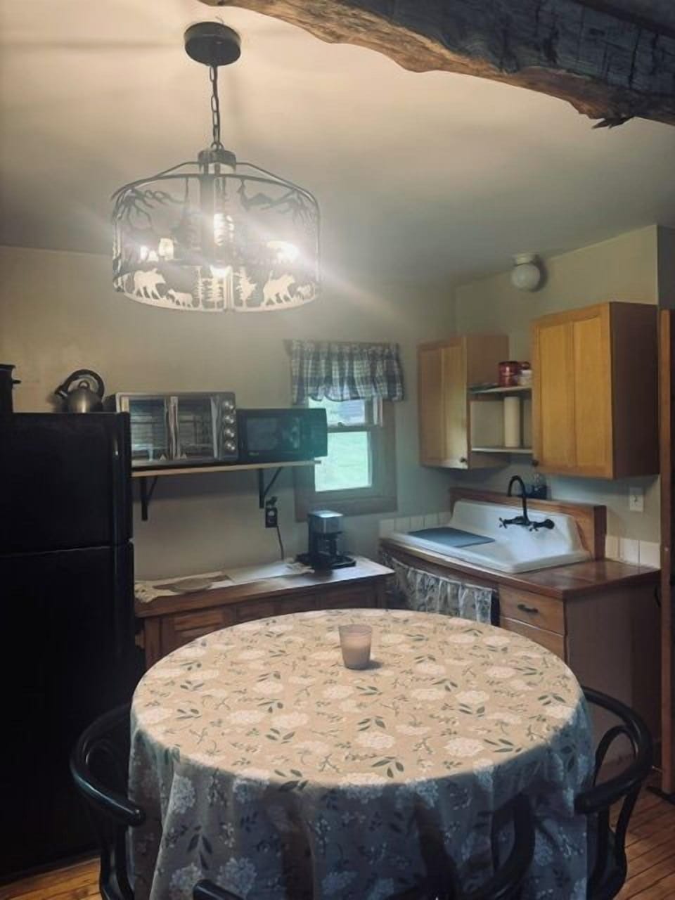 Kitchen and dining area. Nicely equipped kitchen: Large air fryer, refrigerator, microwave, coffee maker, toaster, dishes, utensils and cooking basics