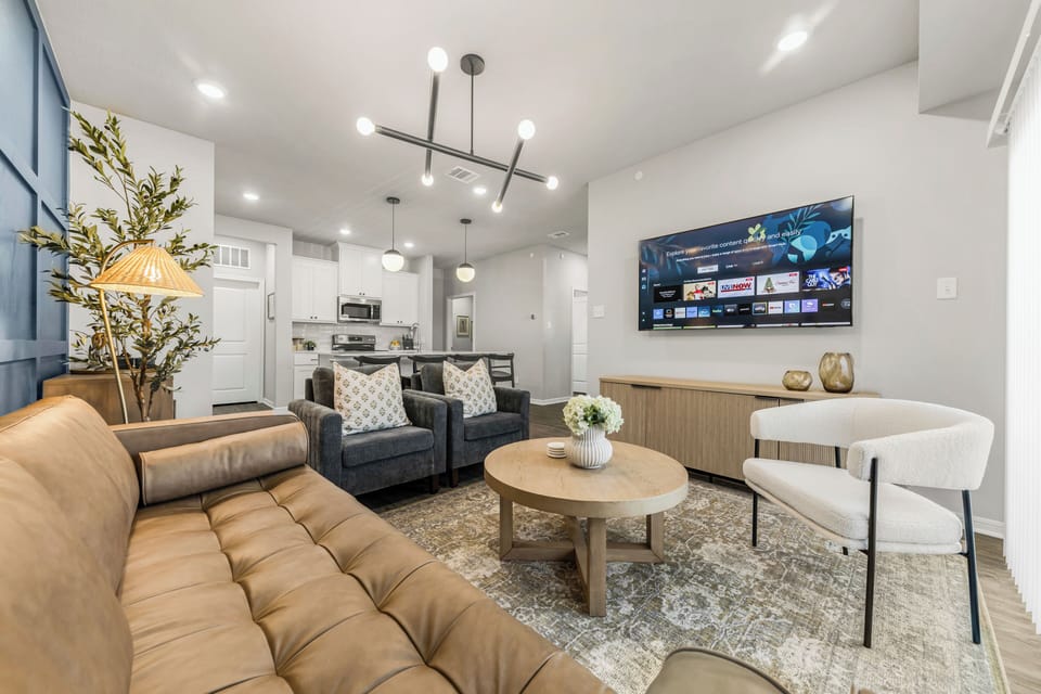 The living room features a 65" smart TV with YouTube, Netflix and other services