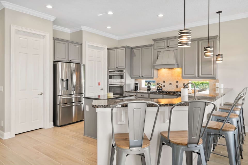 Modern kitchen with island seating makes meals and snacks easy.