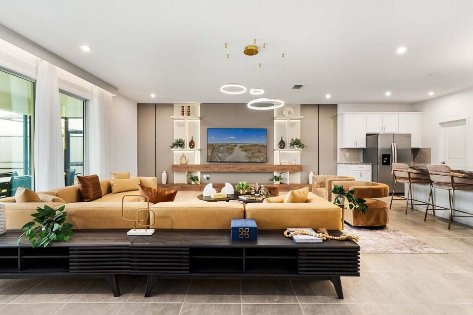 Enjoy a movie night in our cozy living room, complete with a large-screen TV and comfortable plush seating.