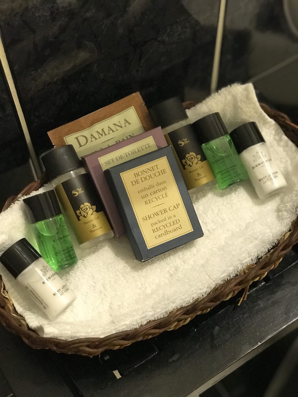Combined shower/tub, designer toiletries, hair dryer, slippers