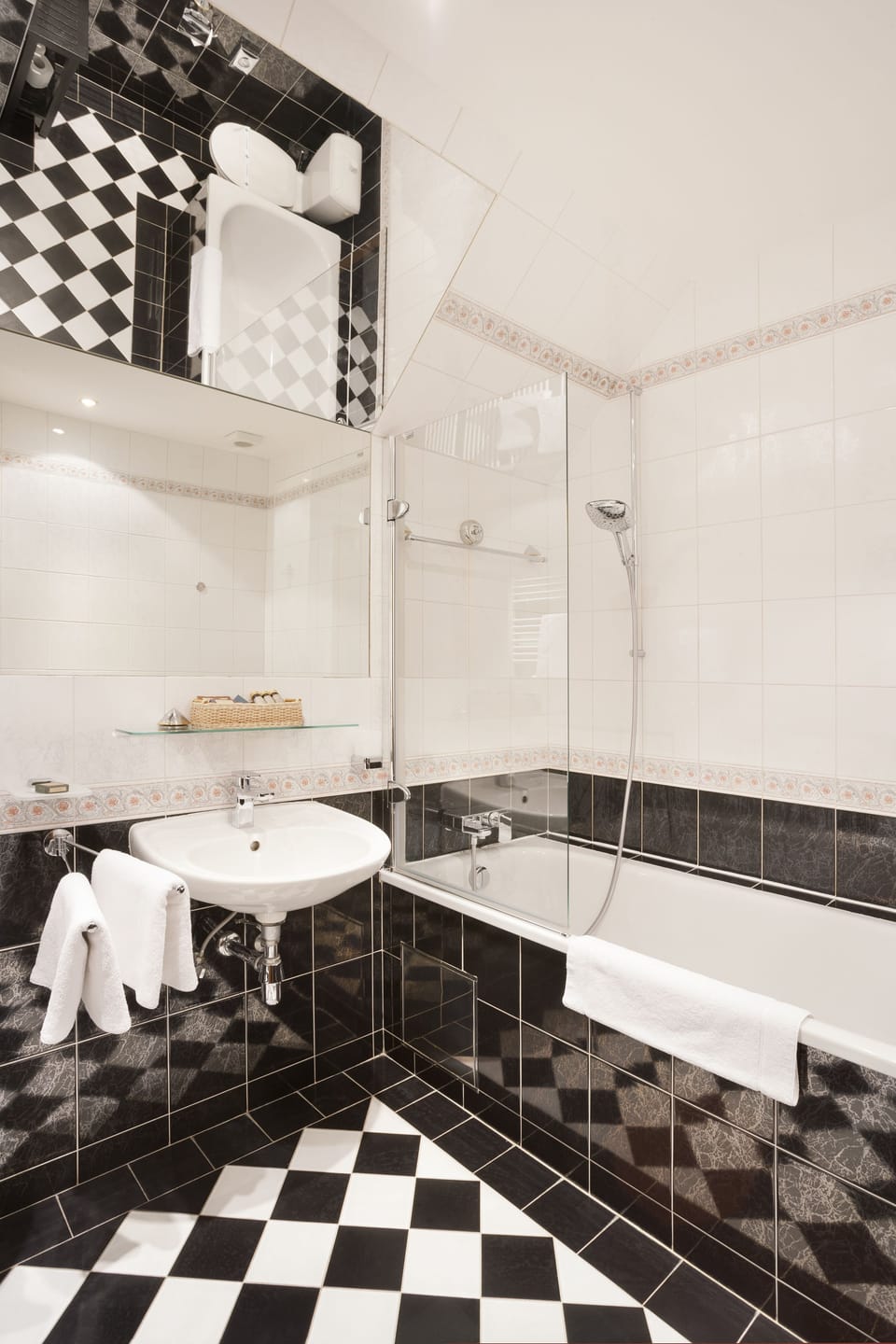 Combined shower/tub, designer toiletries, hair dryer, slippers