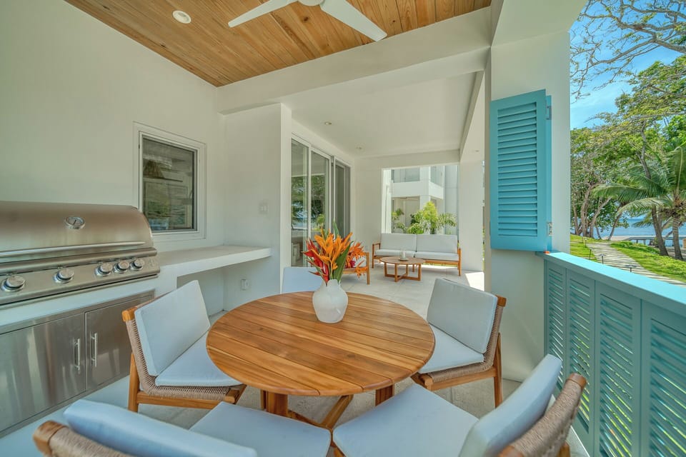Outdoor dining with grill and ceiling fan