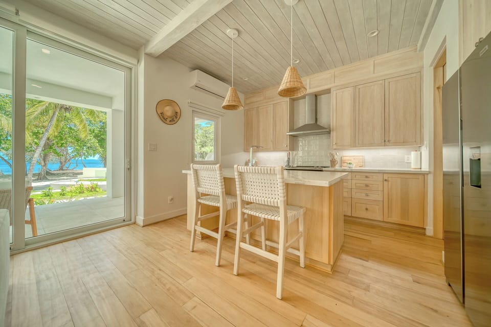 Large chef kitchen with bar seating