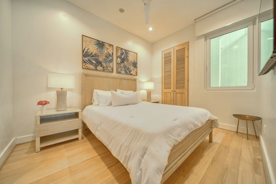 Secondary bedroom with queen bed and both privacy and blackout shades