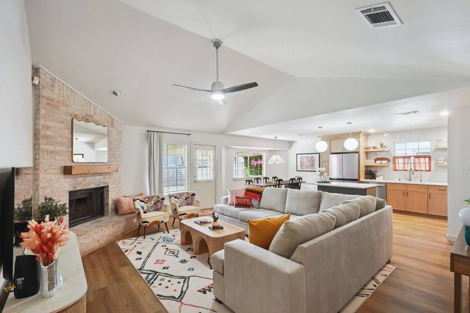 Lots of comfy seating and large TV in the living room