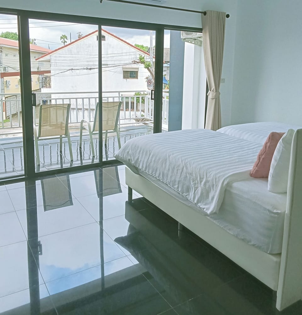 Deluxe Studio, 2 Double Beds, Balcony, City View | Living area | TV